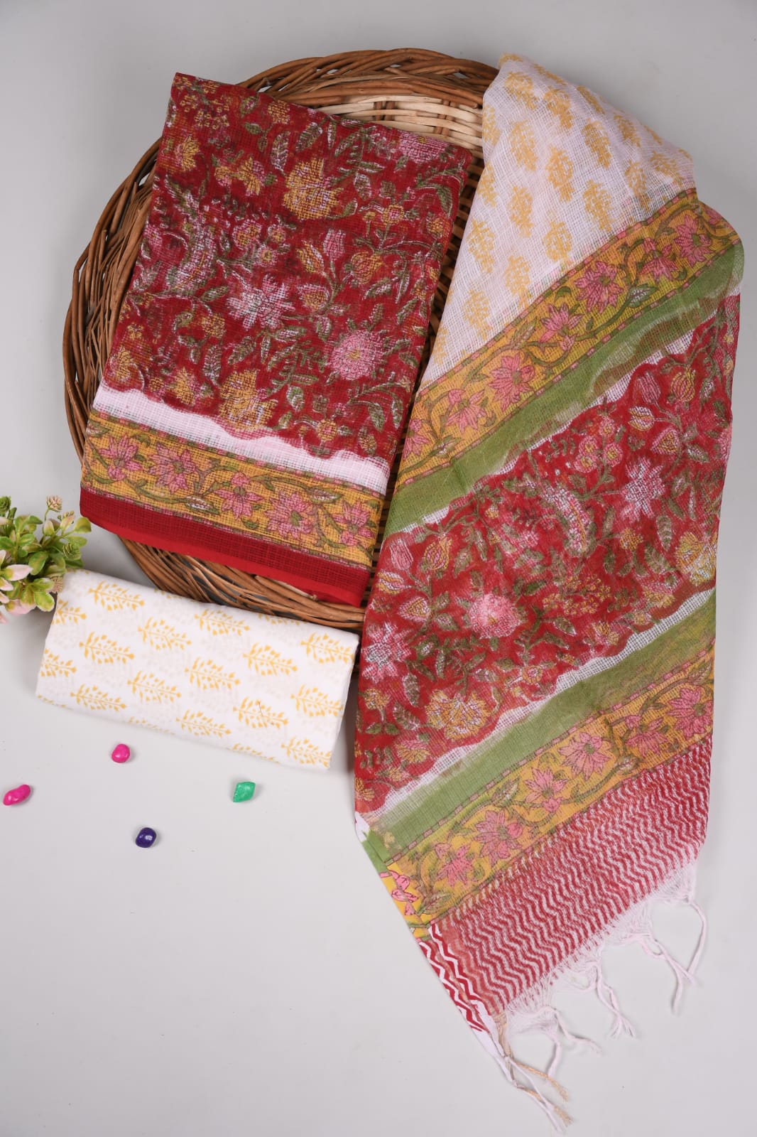 Elegant maroon Kota Doriya suit set with traditional beige dupatta. Comes with soft cotton bottom for comfort. Perfect festive & office wear.