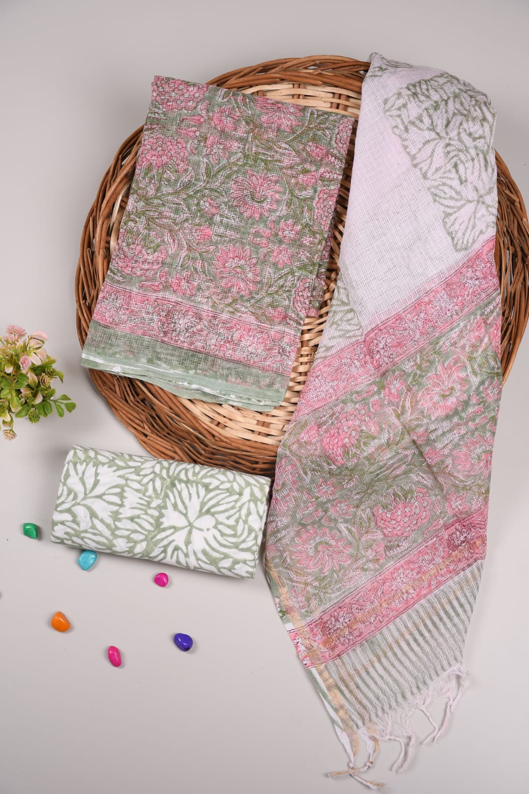 Beautiful green Kota Doriya dress material paired with a grey patterned dupatta. Cotton bottom included. Ideal for daily & party wear.