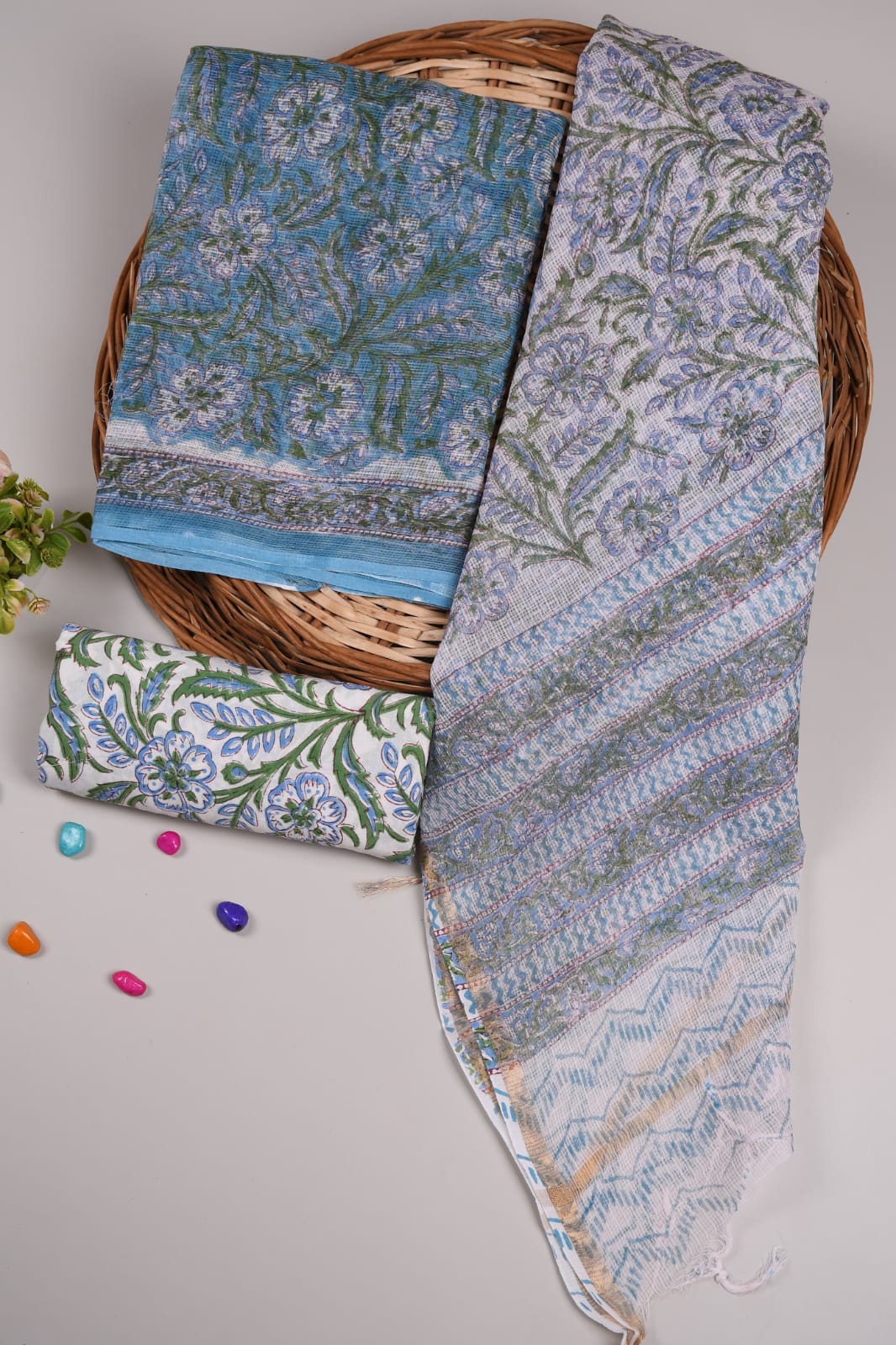 Graceful sky blue Kota Doriya suit with light white dupatta. Soft cotton bottom makes it perfect for summer wear.