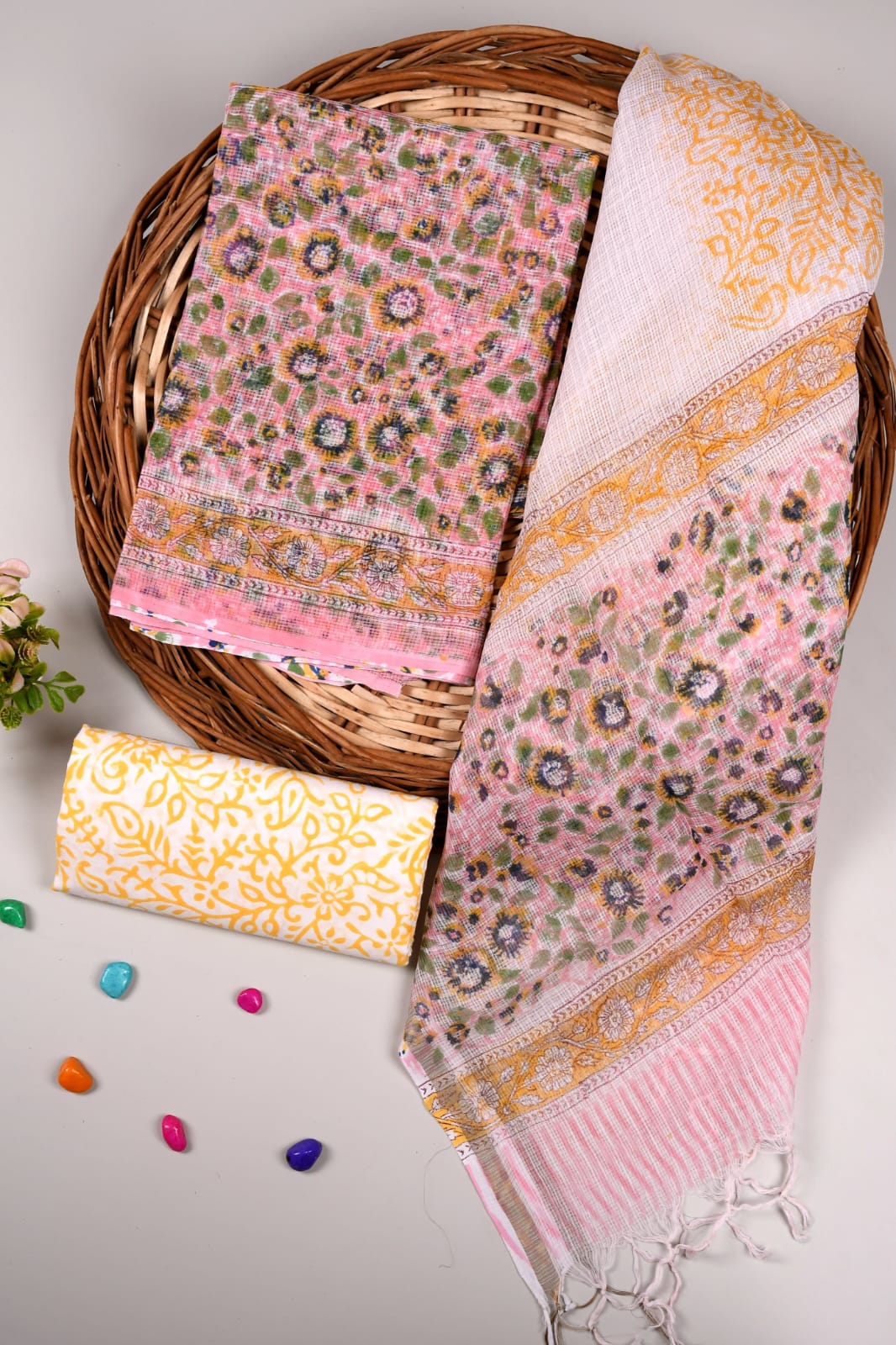 Traditional light pink Kota suit set with golden design dupatta. Cotton bottom included. Perfect for festive occasions.